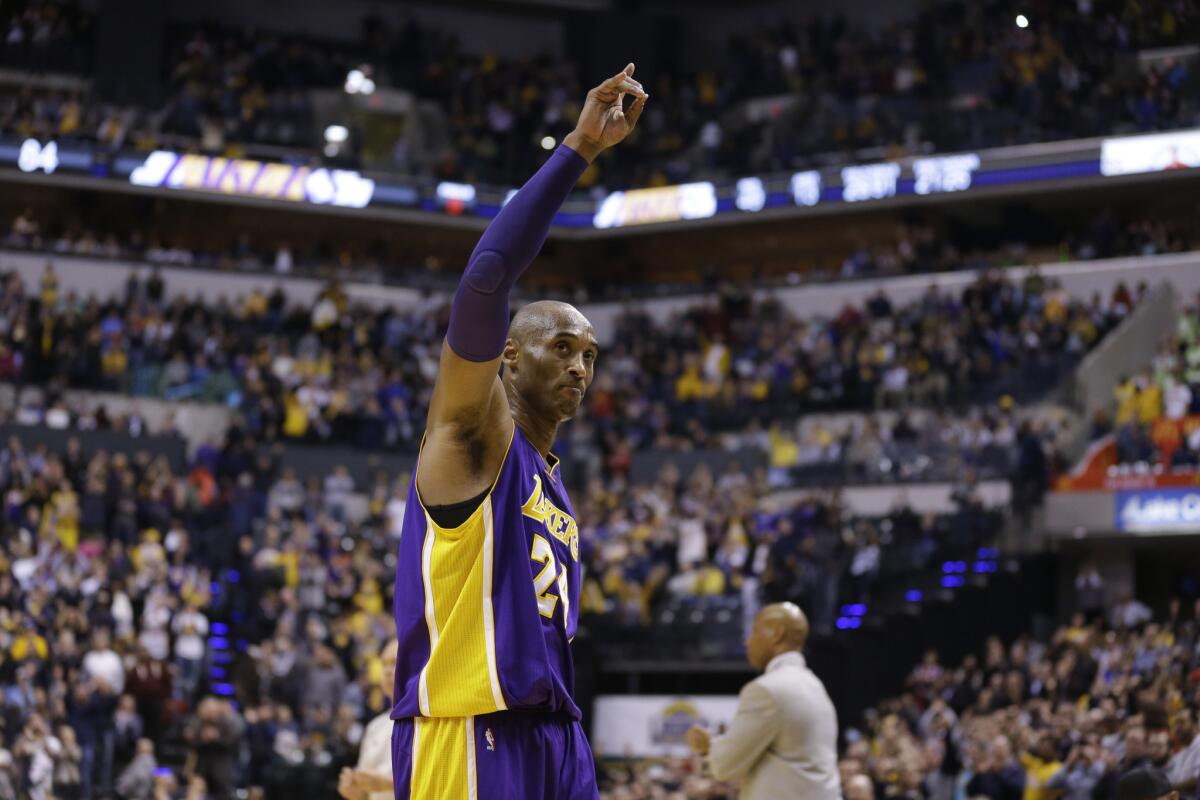 Lakers forward Kobe Bryant (24) waves to Indiana Pacers fans as he leaves the game in the final seconds of the second half.