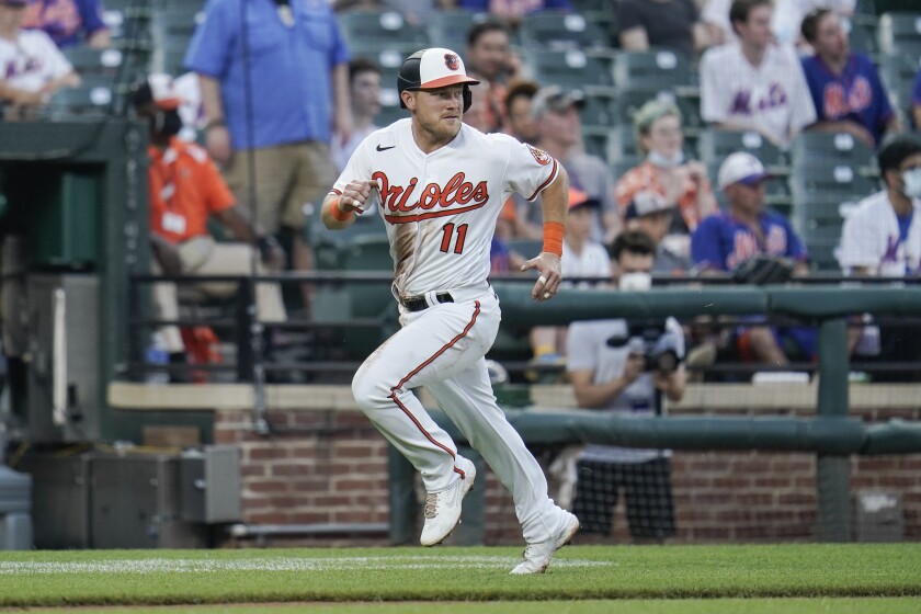 Baltimore Orioles' Pat Valaika runs home before scoring on a double by Cedric Mullins off New York Mets starting pitcher David Peterson during the second inning of a baseball game, Tuesday, June 8, 2021, in Baltimore. (AP Photo/Julio Cortez)