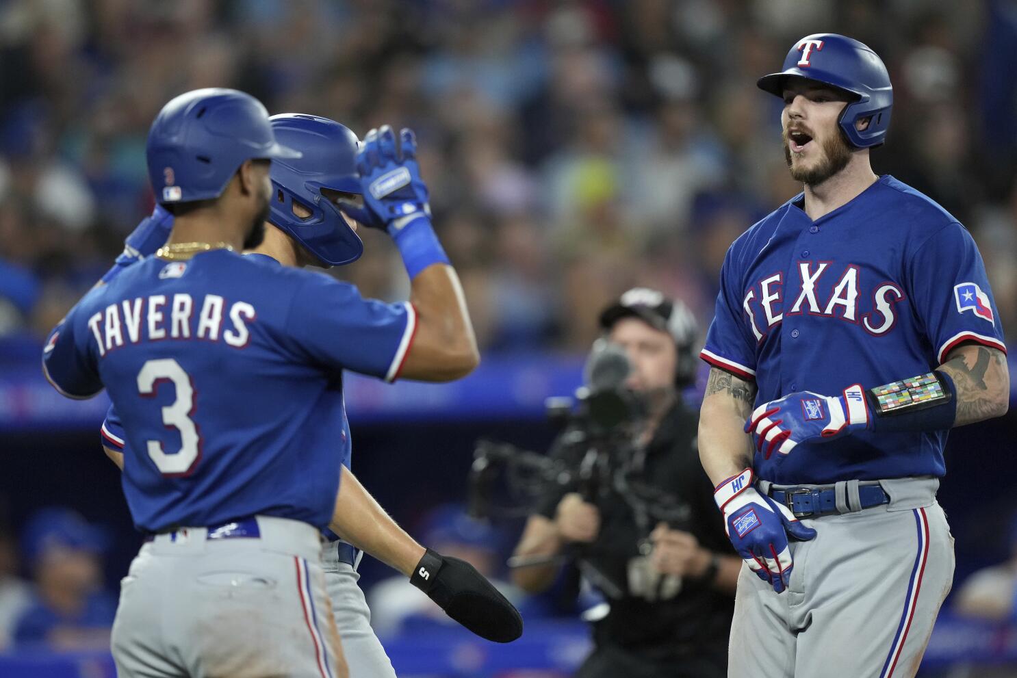 Heim launches grand slam, Carter hits 1st career home run as the Rangers  beat the Blue Jays 10-4 - The San Diego Union-Tribune