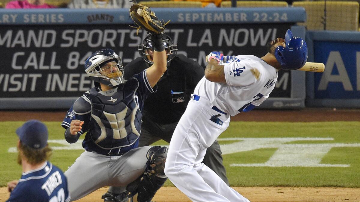 Dodgers batter Matt Kemp leans away from an inside pitch by San Diego Padres reliever Dale Thayer as catcher Rene Rivera gloves the ball during the eighth inning of the Dodgers' 6-3 loss Tuesday.