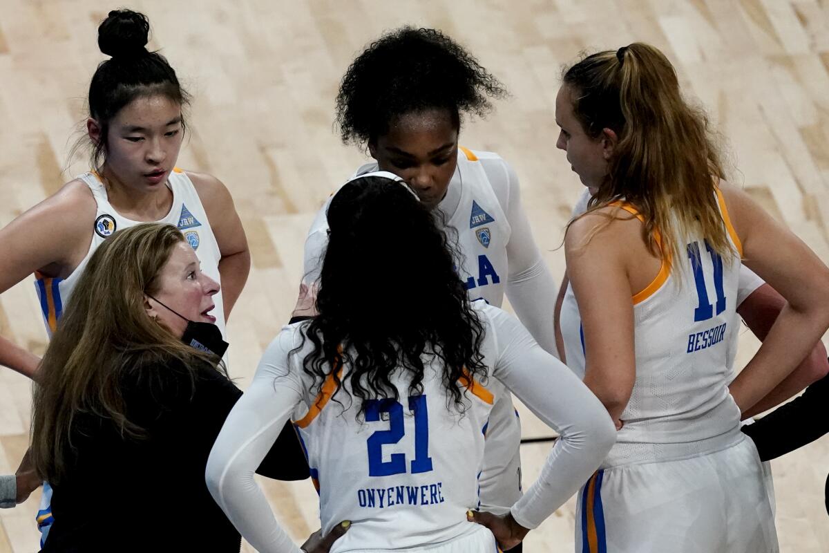 UCLA coach Cori Close talks to her players.