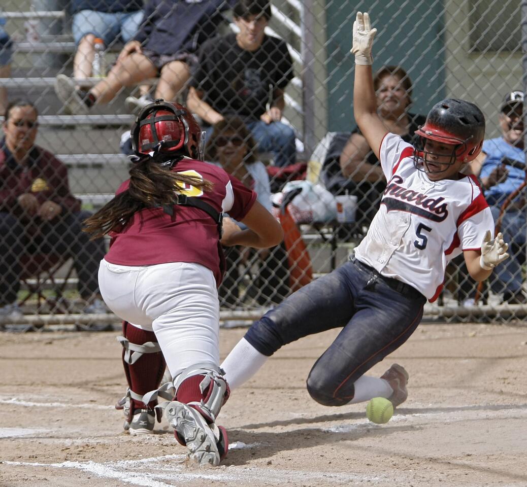 Bell-Jeff player #5 Tiffany Galindo ties the game at 1-1 as she slides safe into home plate in CIF Div. VI quarter final game vs. Cantwell Sacred Heart High School at Gross Park in Burbank on Thursday, May 23, 2013. Bell-Jeff won 3-1.