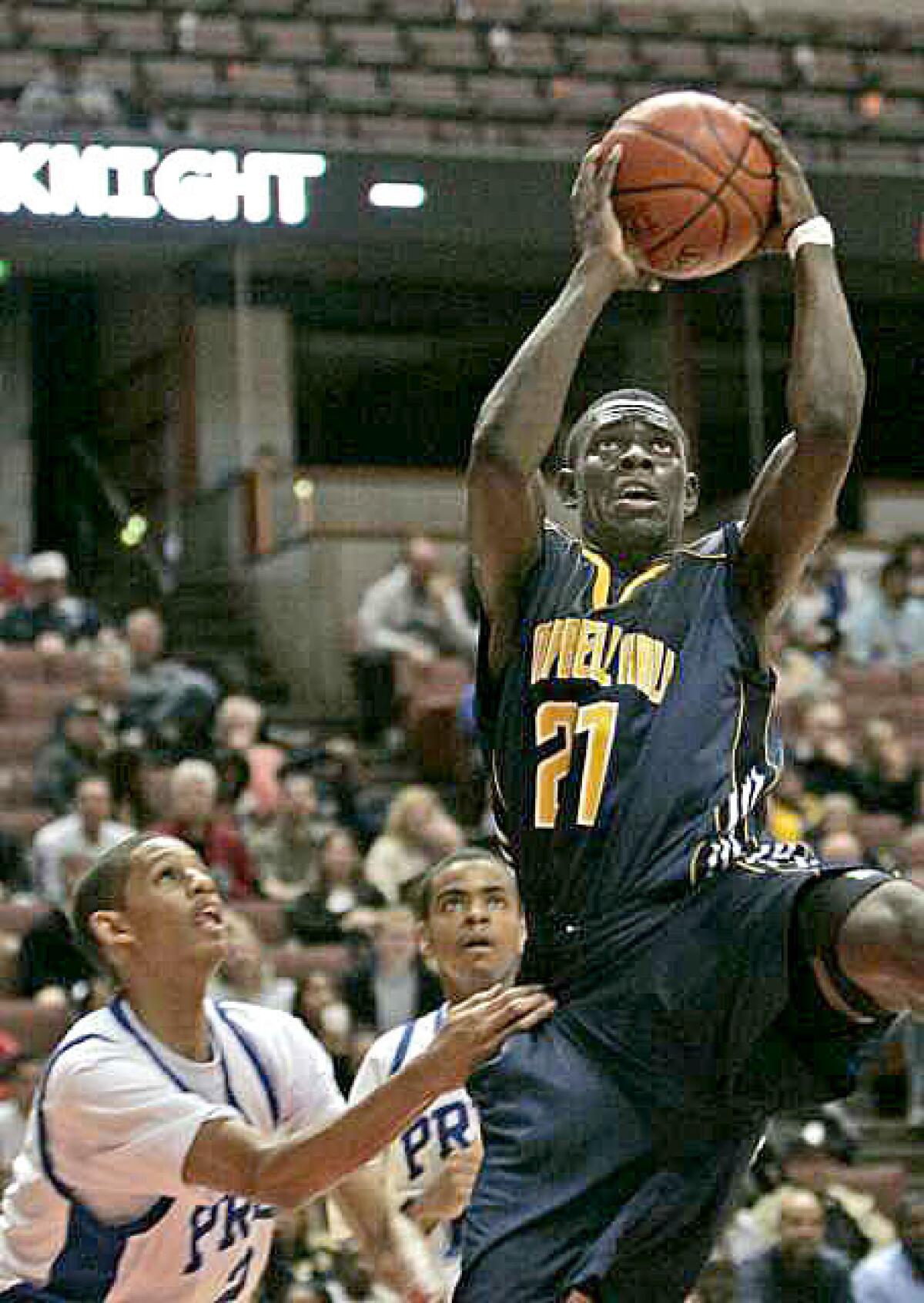 Campbell Hall's Jrue Holiday, driving for a basket against Price during the Southern Section Division III-AA final, is refreshingly unaffected by his status as an elite athlete who will play for UCLA next season.