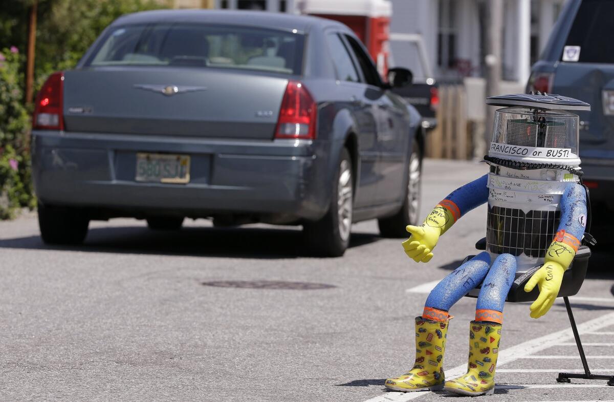 Hitchbot, a hitchhiking robot, is seen in Marblehead, Mass., on July 17. This week, as it continued its journey, the robot was damaged beyond repair in Philadelphia.