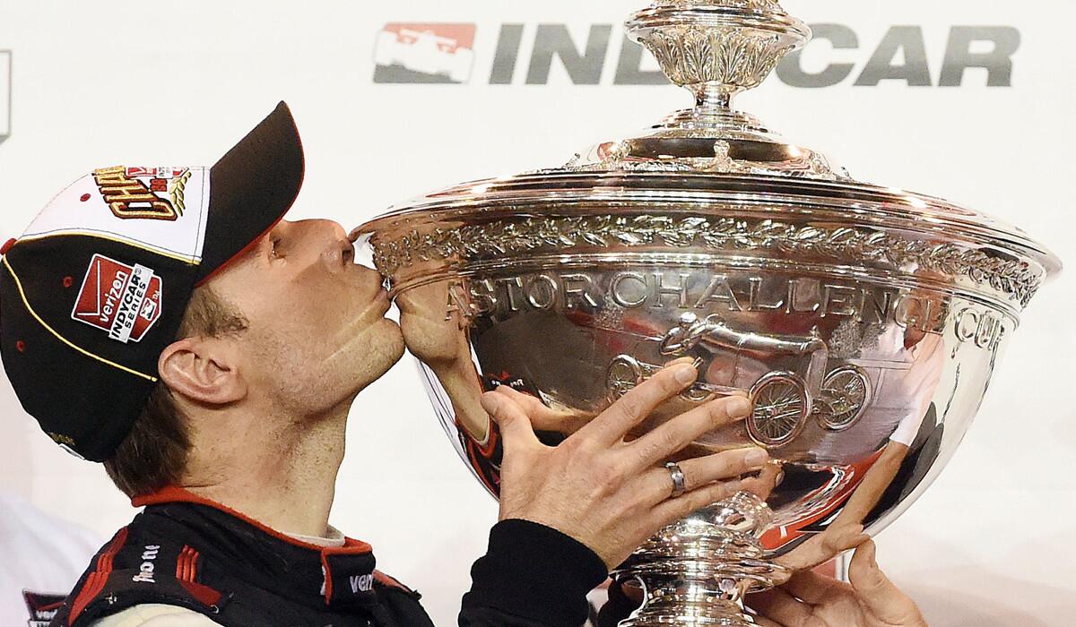Will Power kisses the Astor Cup after winning the IndyCar Series season championship Saturday in Fontana, Calif.