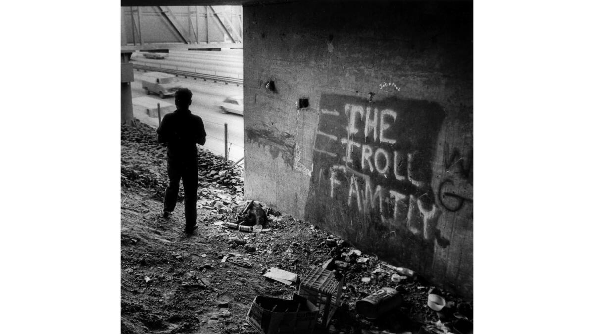 Nov. 8, 1982: People living under a Hollywood Freeway overpass spray-painted "The Troll Family" on a wall.