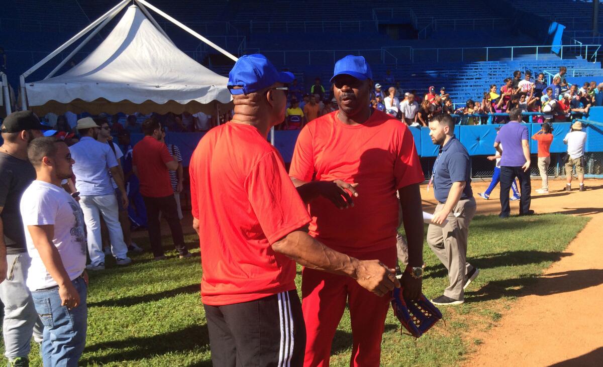 Former Cuban pitching great Pedro Luis Lazo takes part at a baseball camp in Cuba during the MLB goodwill tour.
