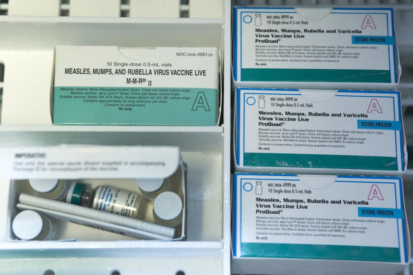 Boxes of single-doses vials of the measles-mumps-rubella virus vaccine live, or MMR vaccine and ProQuad vaccine are kept frozen inside a freezer at the practice of Dr. Charles Goodman in Northridge.