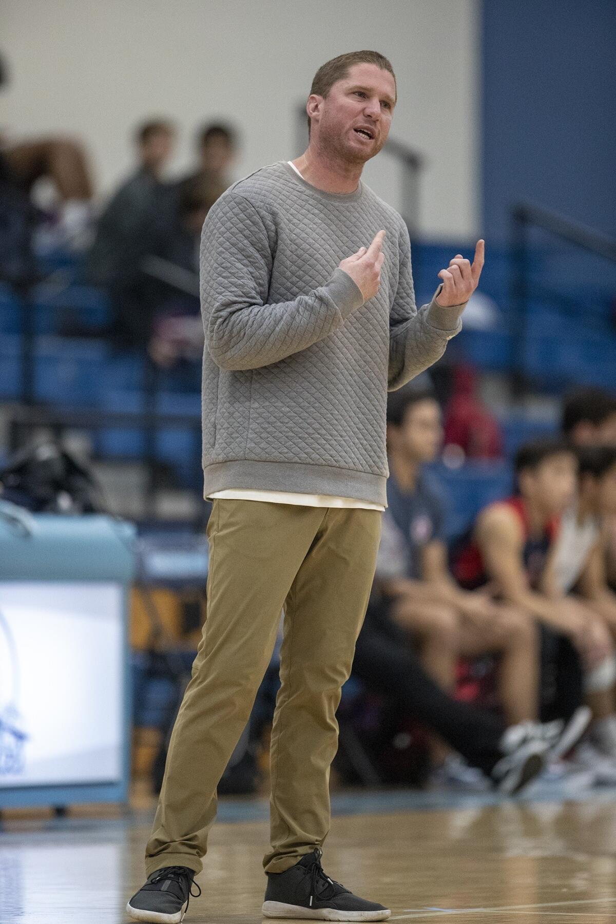 Corona del Mar coach Sam Stafford gives directions to his boys' team in a nonleague match against Beckman on Feb. 21.