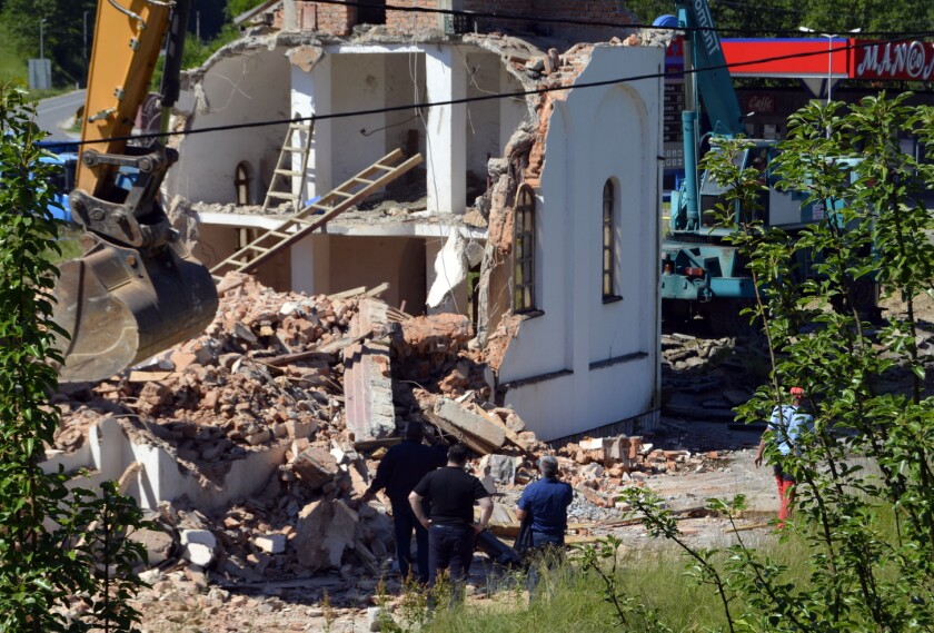 Bosnian authorities demolish a Serbian Orthodox church.