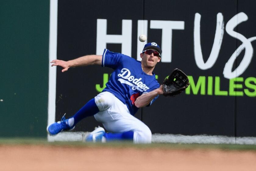 GLENDALE, ARIZONA - MARCH 09: Brad Miller #45 of the Los Angeles Dodgers catches a fly ball during the spring training game against the Seattle Mariners at Camelback Ranch on March 09, 2019 in Glendale, Arizona. (Photo by Jennifer Stewart/Getty Images) ** OUTS - ELSENT, FPG, CM - OUTS * NM, PH, VA if sourced by CT, LA or MoD **