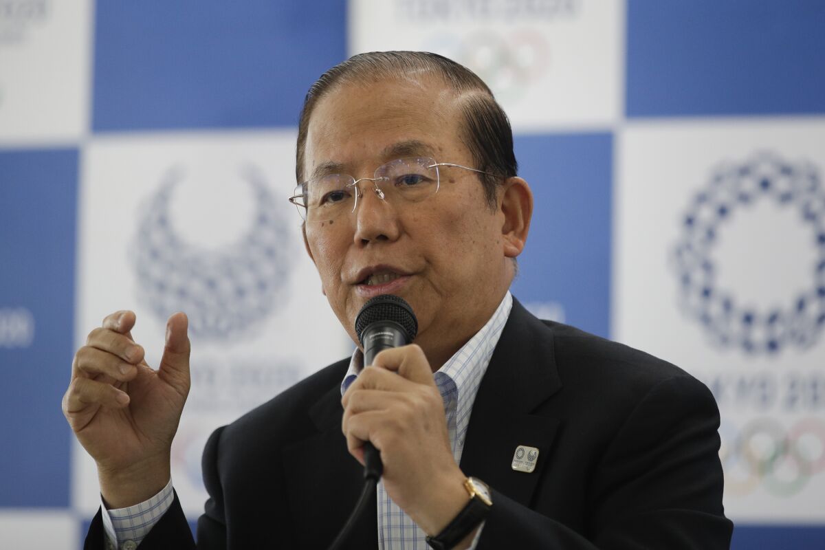 Toshiro Muto, CEO of the 2020 Tokyo Olympics organizing committee, speaks during a news conference Tuesday, June 11, 2019, in Tokyo. Next year's postponed Tokyo Olympics — if they happen — will be like no other, particularly for non-Japanese fans if they are allowed to enter in the middle of the COVID-19 pandemic. Tokyo organizing committee CEO Muto, after a meeting Thursday, Nov. 12, 2020, about infection countermeasures, confirmed for the first time that a limited number of non-Japanese fans may be allowed to attend. (AP Photo/Jae C. Hong)