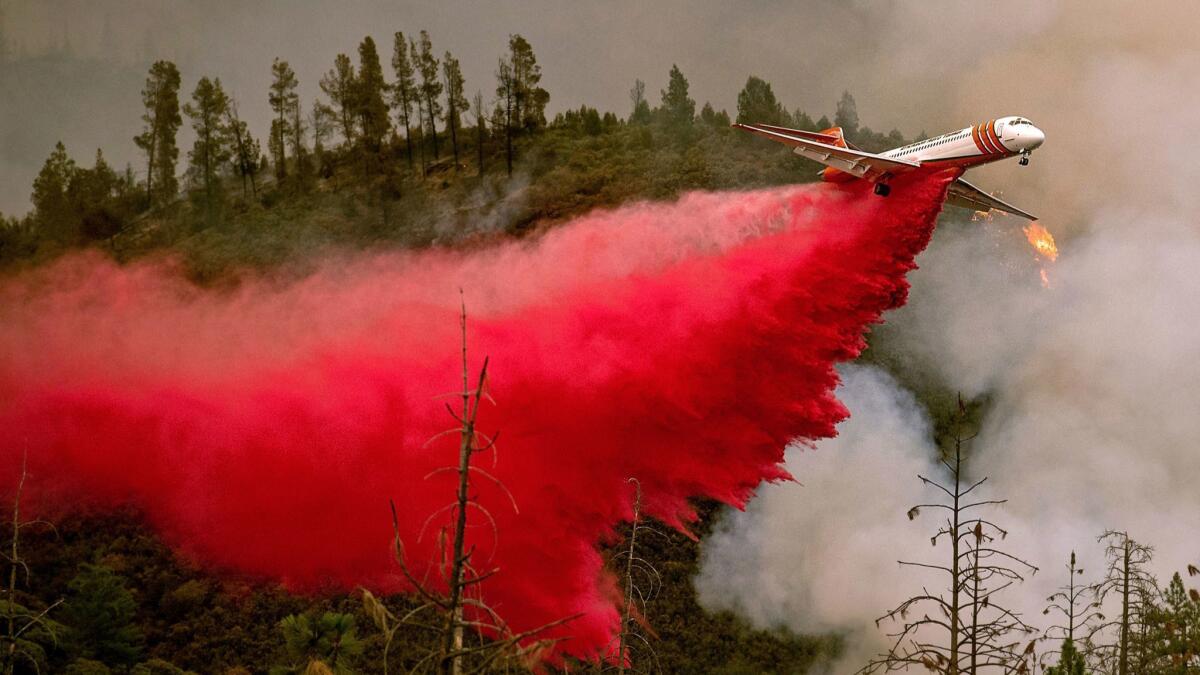 An air tanker drops retardant while battling the Ferguson fire in Stanislaus National Forest, near Yosemite National Park on Saturday.