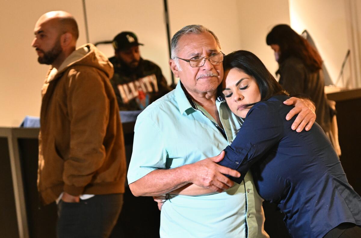 Jose Luis Lopez, husband of kidnapping victim Maria Del Carmen Lopez, holds his daughter Zonia.
