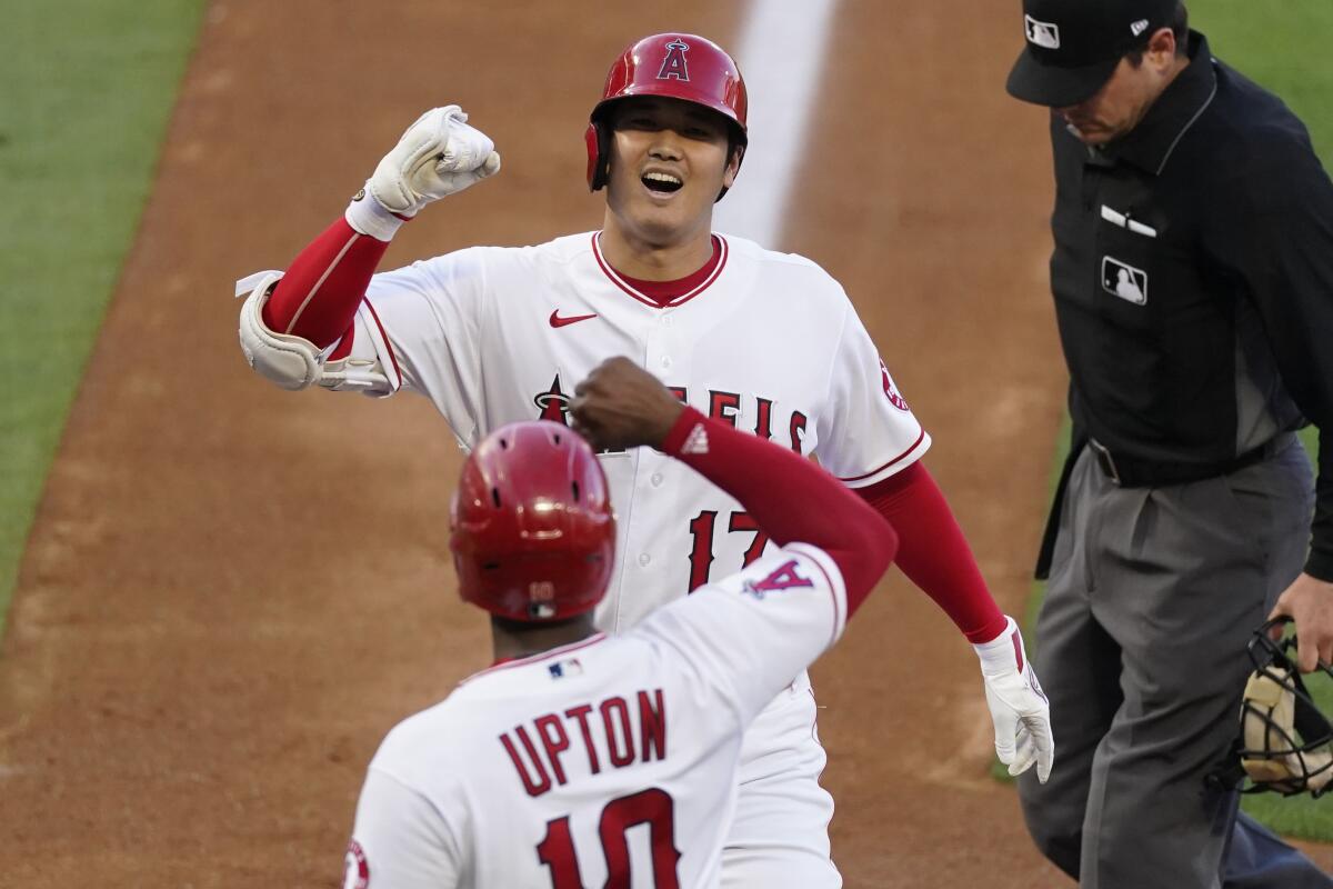 Shohei Ohtani celebrates after hitting the longest home run of his career