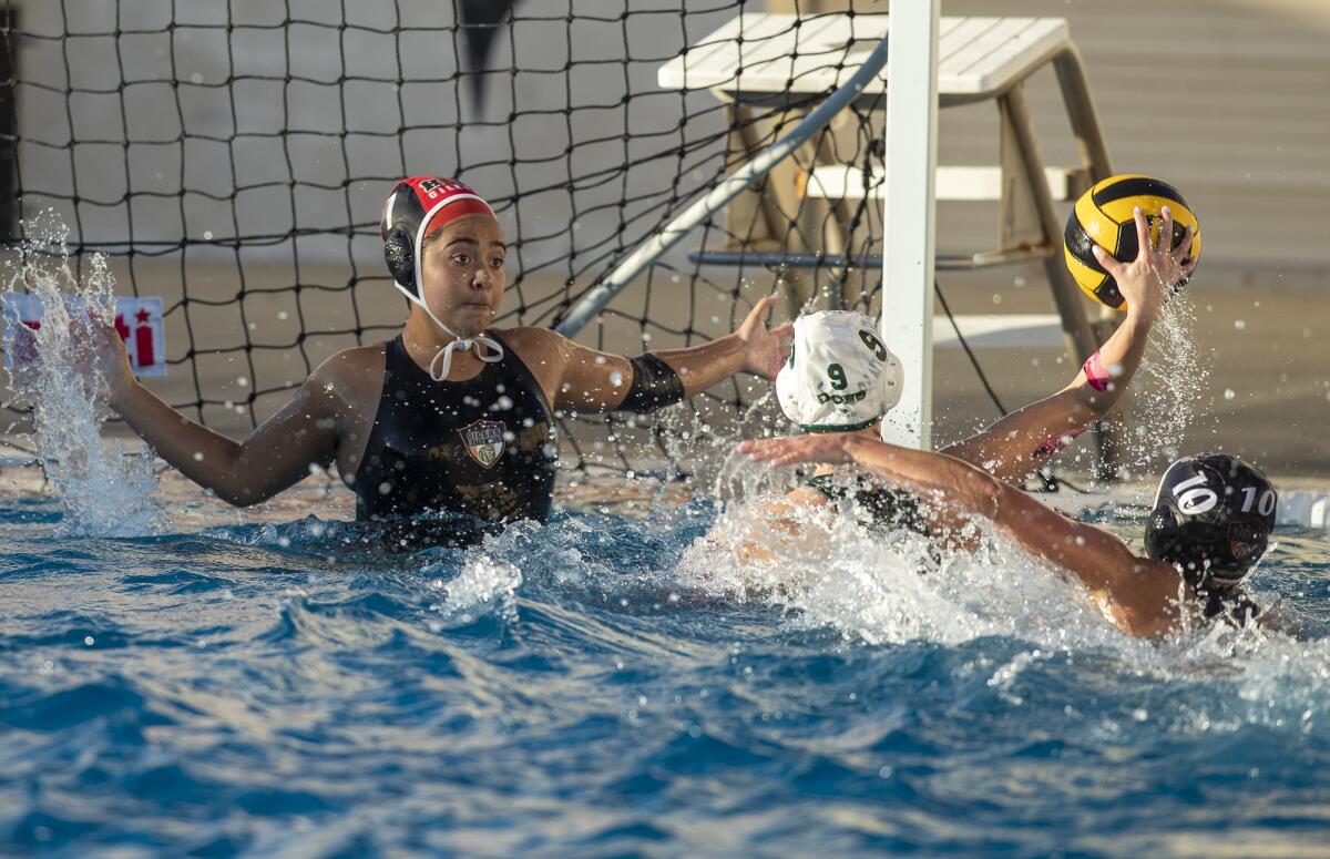 Huntington Beach's Marilyn Rodriguez sets up in an attempt to block a shot from Santa Barbara's Allison Bartholomew.