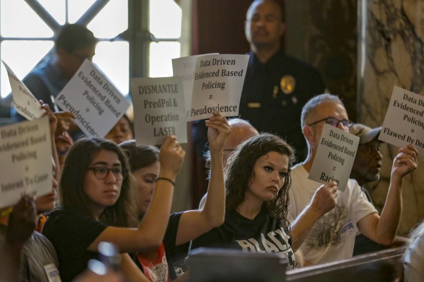 LOS ANGELES, CA JULY 24, 2018 -- Protestors at the Los Angeles Police Commission's special meeting on the LAPD's use of data in policing, including so-called predictive policing analysis that pinpoints crime hotspots and people who are at highest risk of committing more crimes.(Irfan Khan / Los Angeles Times)