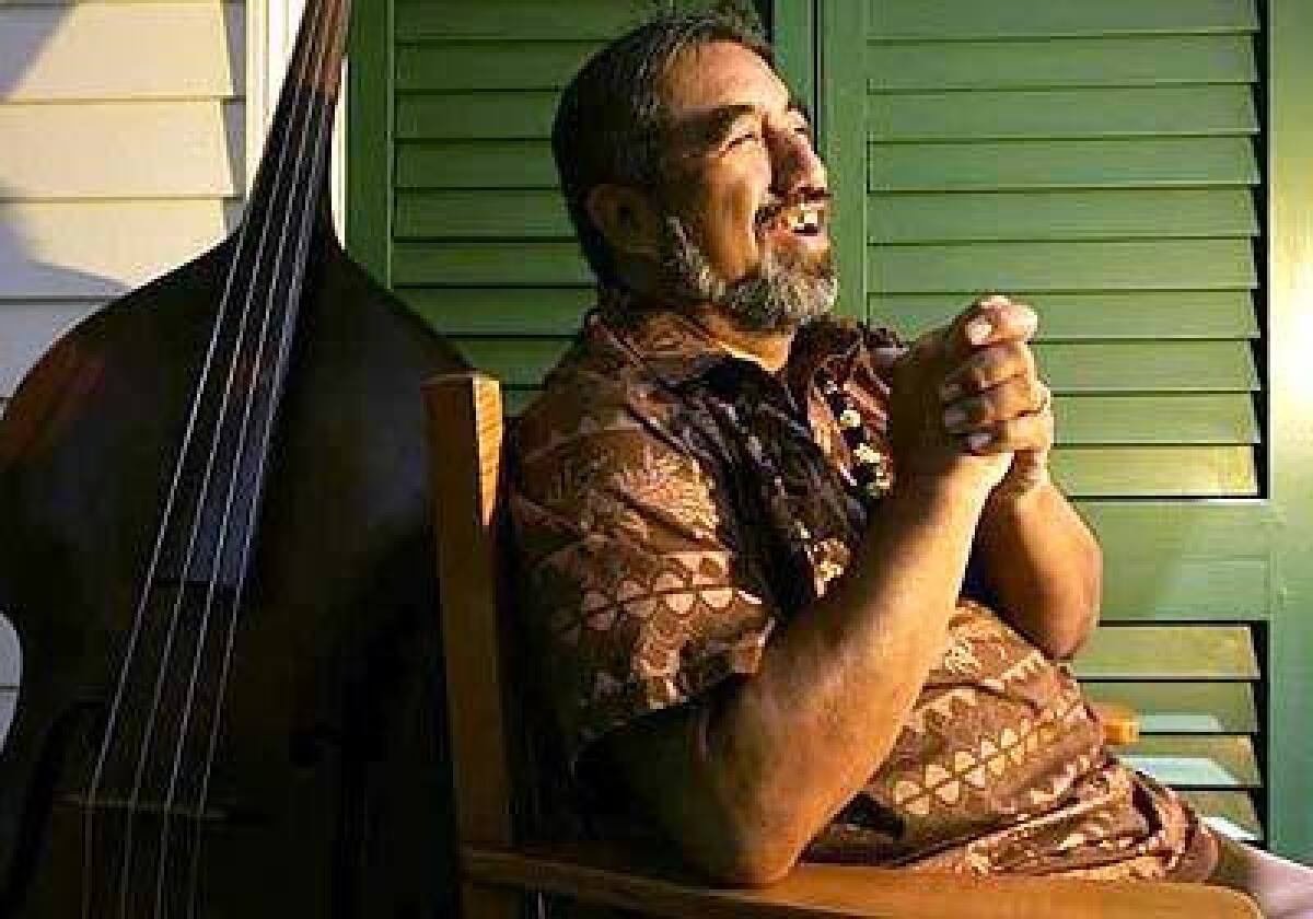 Bassist Aaron Mahi performs around Honolulu, telling stories from Hawaii's past and present with his music.
