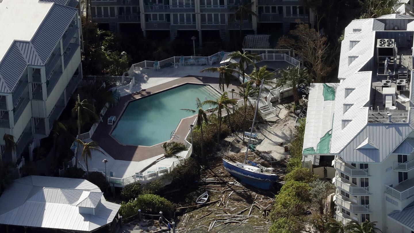 A sailboat is pushed up between two buildings in the aftermath of Hurricane Irma on Tuesday, Sept. 12, 2017, in Key West, Fla.
