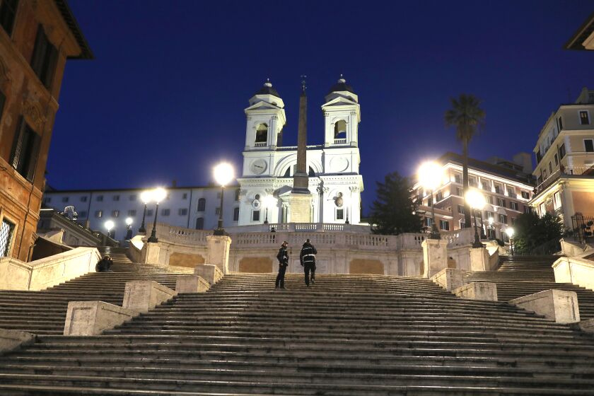 Two police officers are the only ones on Rome's Spanish Steps on March 10 amid the coronavirus outbreak.