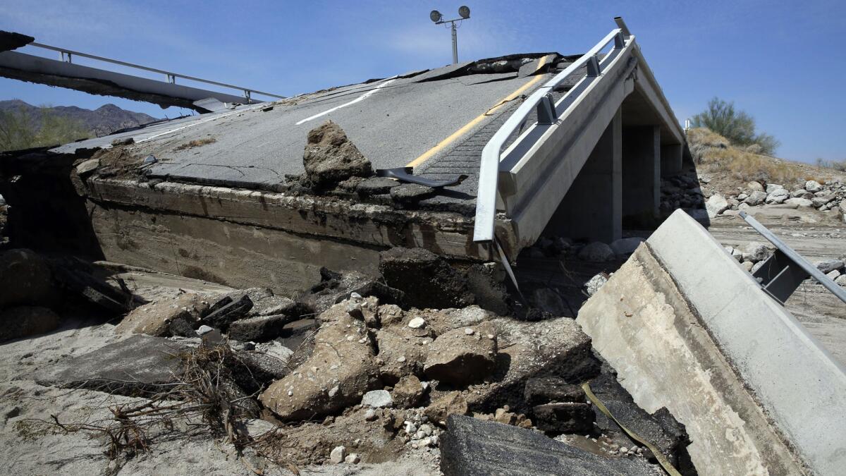 The eastbound bridge of Interstate 10 between Coachella and the Arizona border lies in ruins after yesterday's flash floods washed out the bridge over a desert wash. Traffic in both directions of the major east-west highway has been stopped indefinitely while engineers assess the damage.