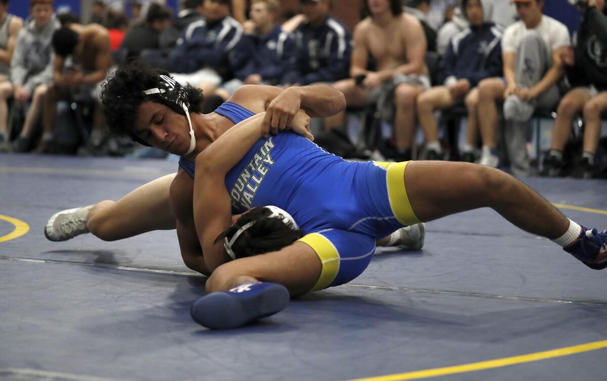 Fountain Valley’s Luis Ramirez competes in a 145-pound match during the first round of the CIF Southern Section Division 3 dual meet championships at Fountain Valley High on Feb. 1.