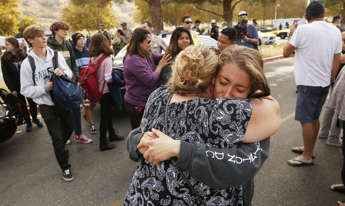 Students and family members leave Central Park in Santa Clarita