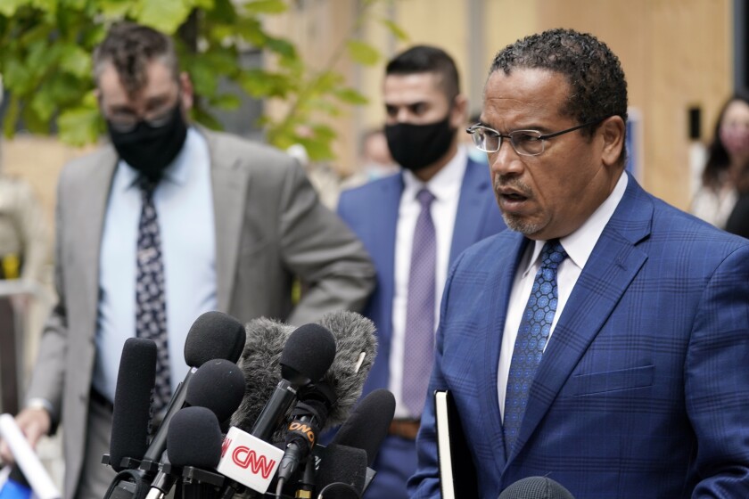 FILE - In this Sept. 11, 2020 file photo, Minnesota Attorney General Keith Ellison, right, addresses reporters outside the Hennepin County Family Justice Center in Minneapolis. Jury selection begins Monday, March 8, 2021, for Derek Chauvin, a former Minneapolis police officer charged with murder and manslaughter in George Floyd's death. Ellison is the lead prosecutor in the case. (AP Photo/Jim Mone, File)