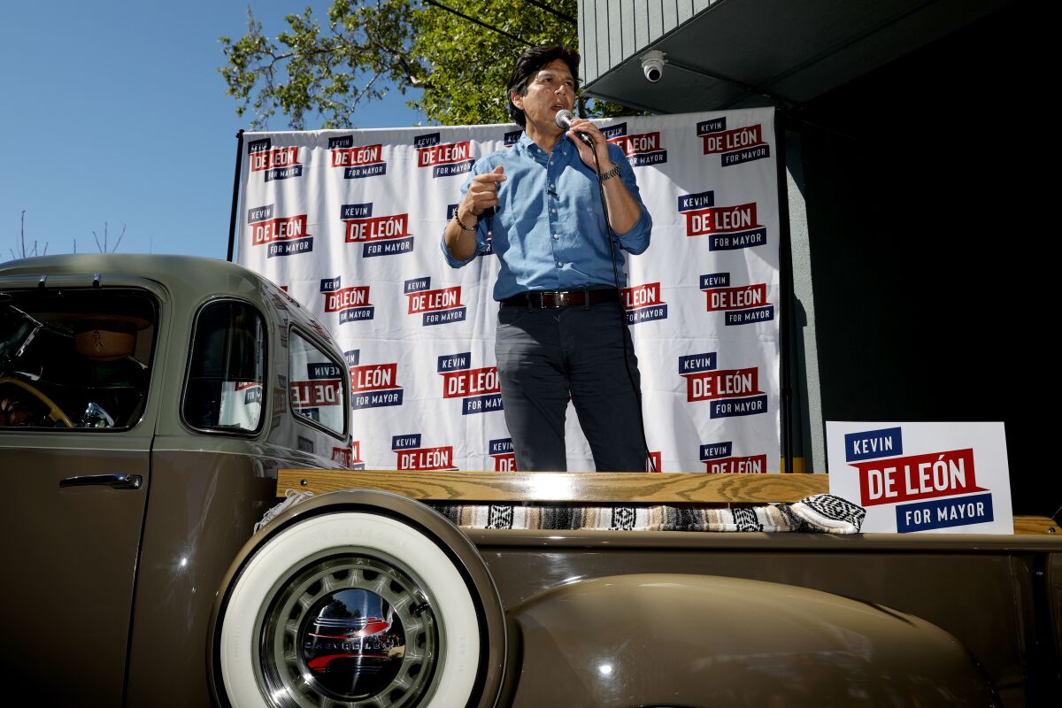 Los Angeles City Councilman and mayoral candidate Kevin de León speaks from the bed of a truck.