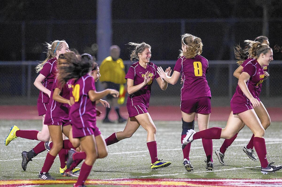 Estancia High's Delani Guyot, left, is congratulated by Samantha Haynes after scoring a goal against Costa Mesa on Thursday.