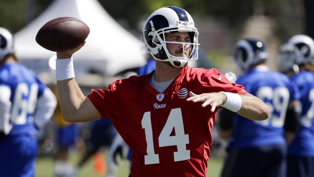 Rams quarterback Sean Mannion participates in a drill Saturday during the first day of training camp.