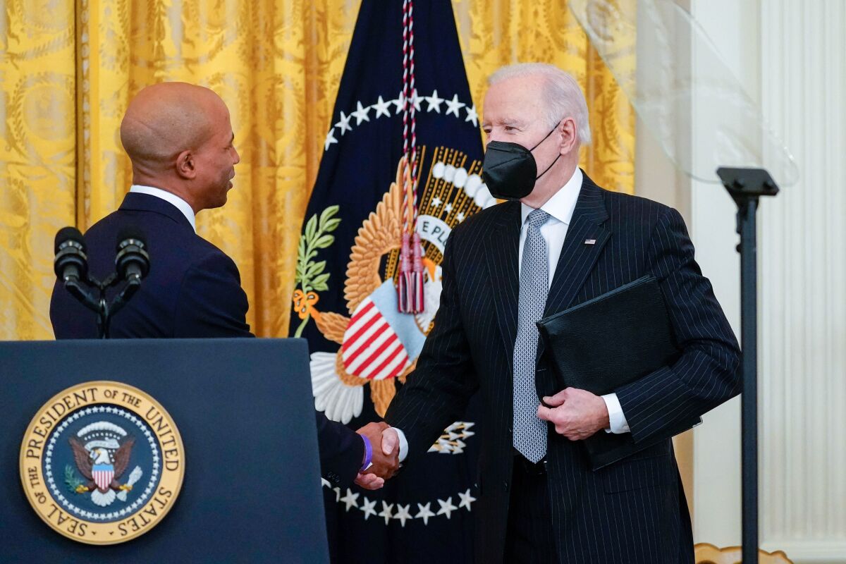 President Biden shakes hands with Dr. Edjah Nduom at the White House