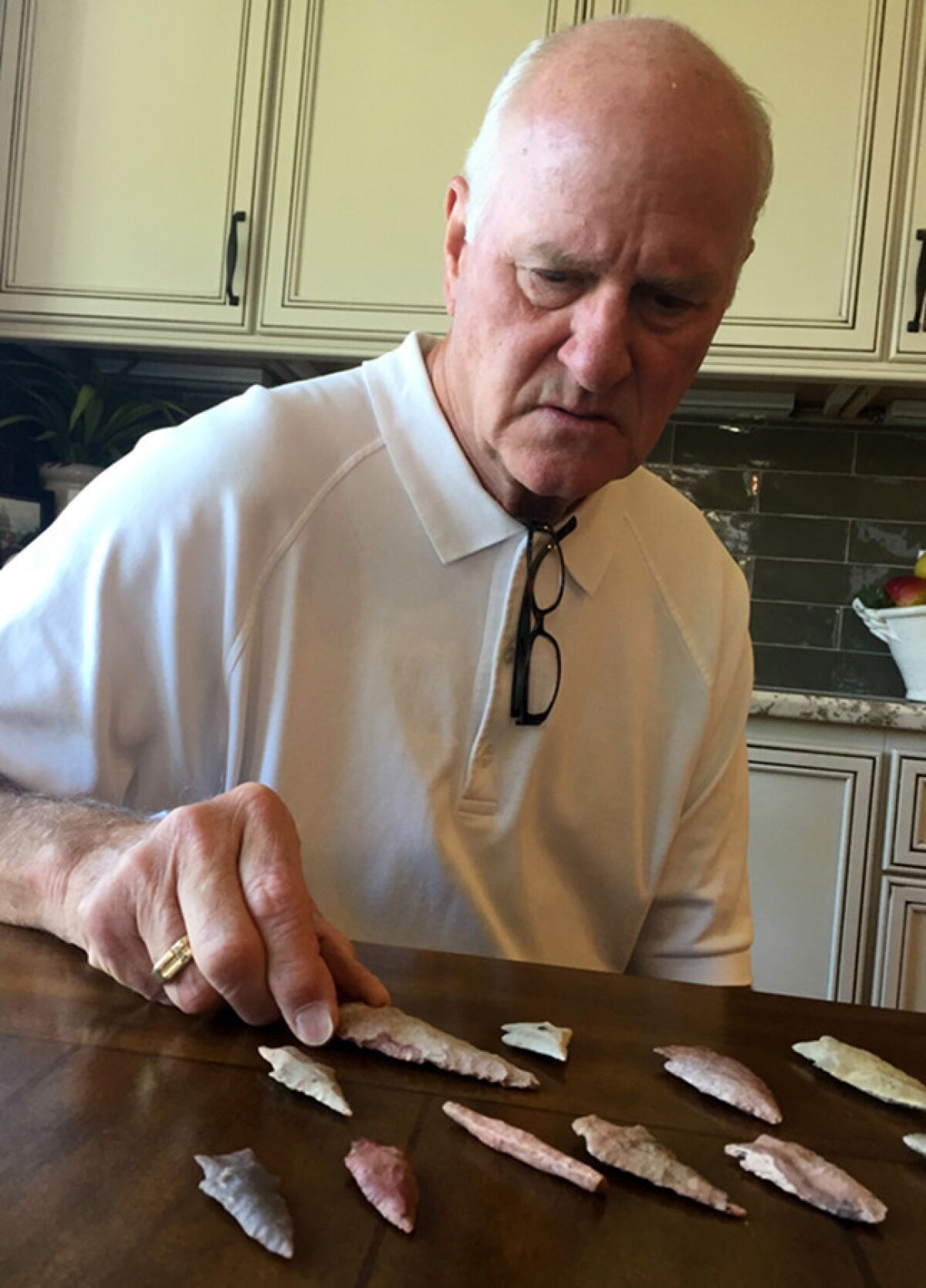 Russell Bishop still has the arrowheads he collected as a kid in Arkansas City.