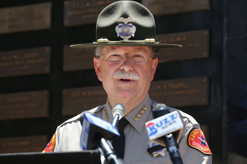 Sheriff Donny Youngblood speaks into a microphone