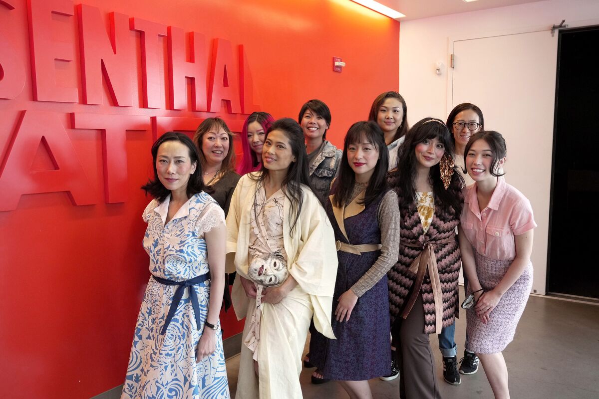 A group of people pose together.