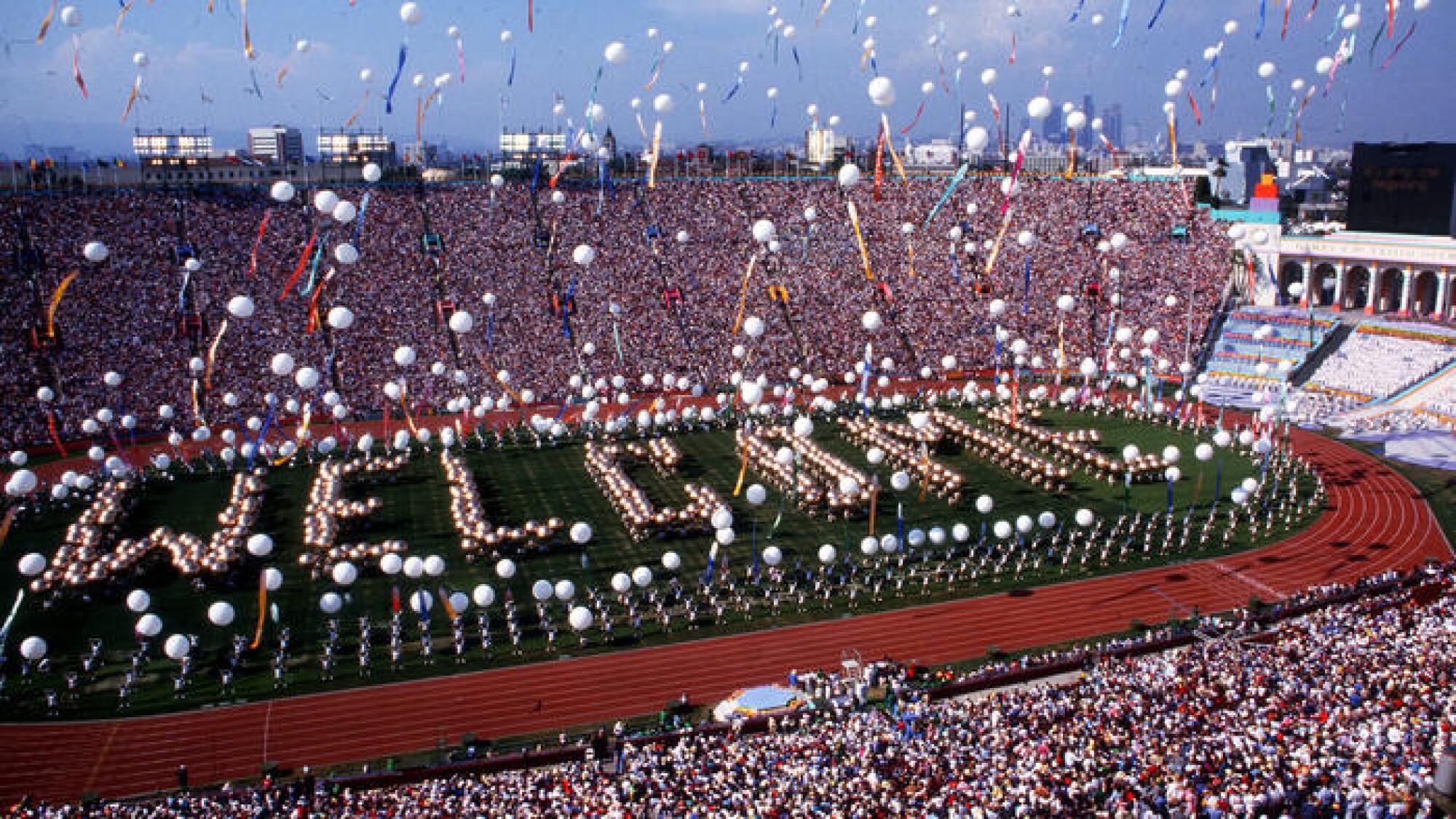"Welcome" is spelled out on the field of the L.A. Coliseum during the 1984 Olympics opening ceremony. 