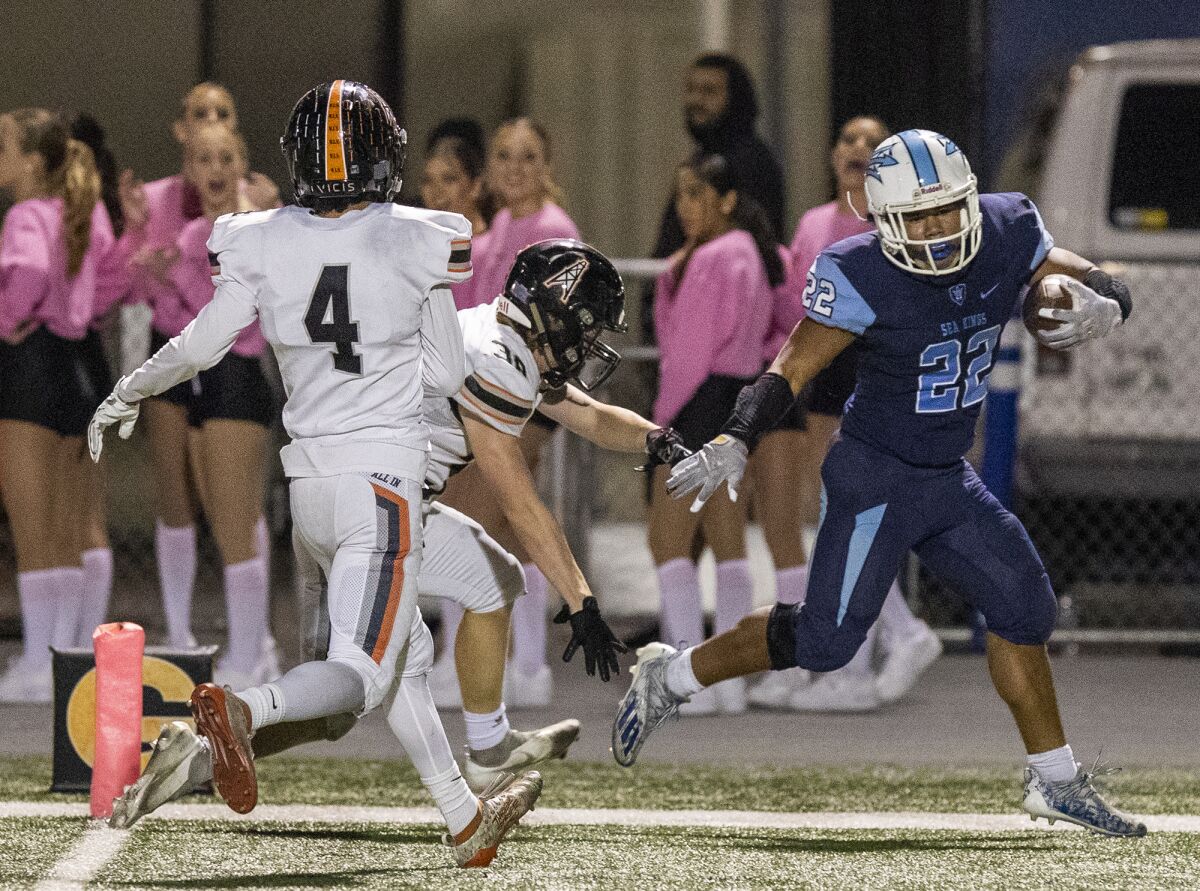 Corona del Mar's Evan Sanders runs in for a touchdown during Friday's Sunset League game.