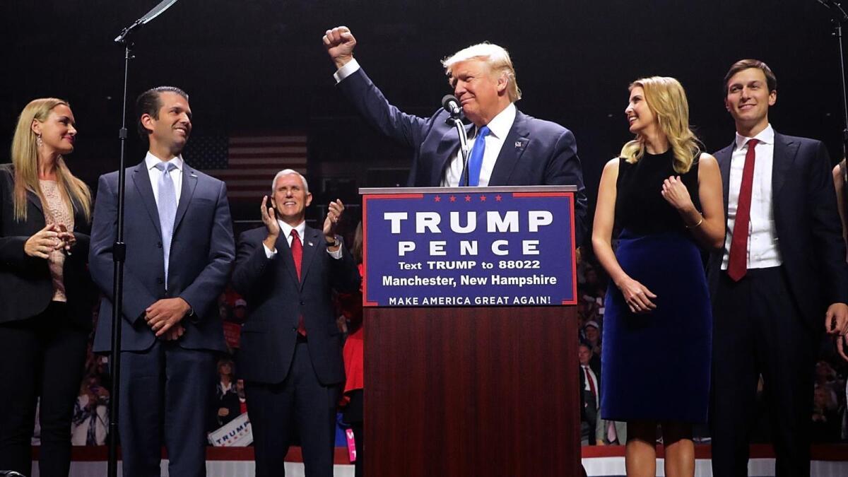 Donald Trump appears at a campaign rally last year. His son, Donald Trump Jr., is second from left.