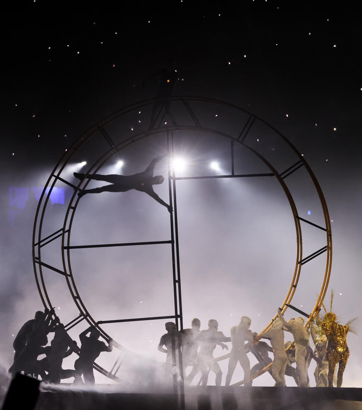 Performers raise Olympic rings during the closing ceremony of the 2024 Paris Olympics at Stade de France on Sunday.