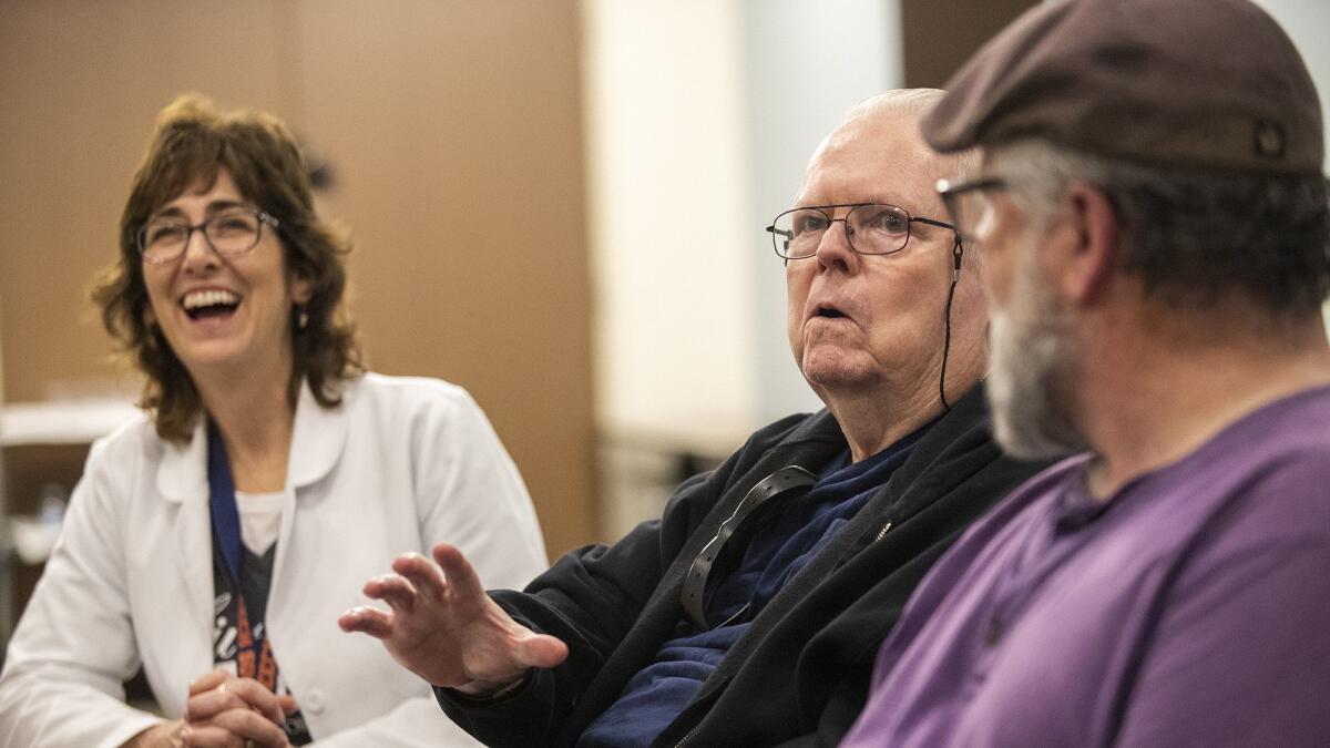 Tom Wright, center, participates in a Parkinson’s disease therapy session at Los Alamitos Medical Center.