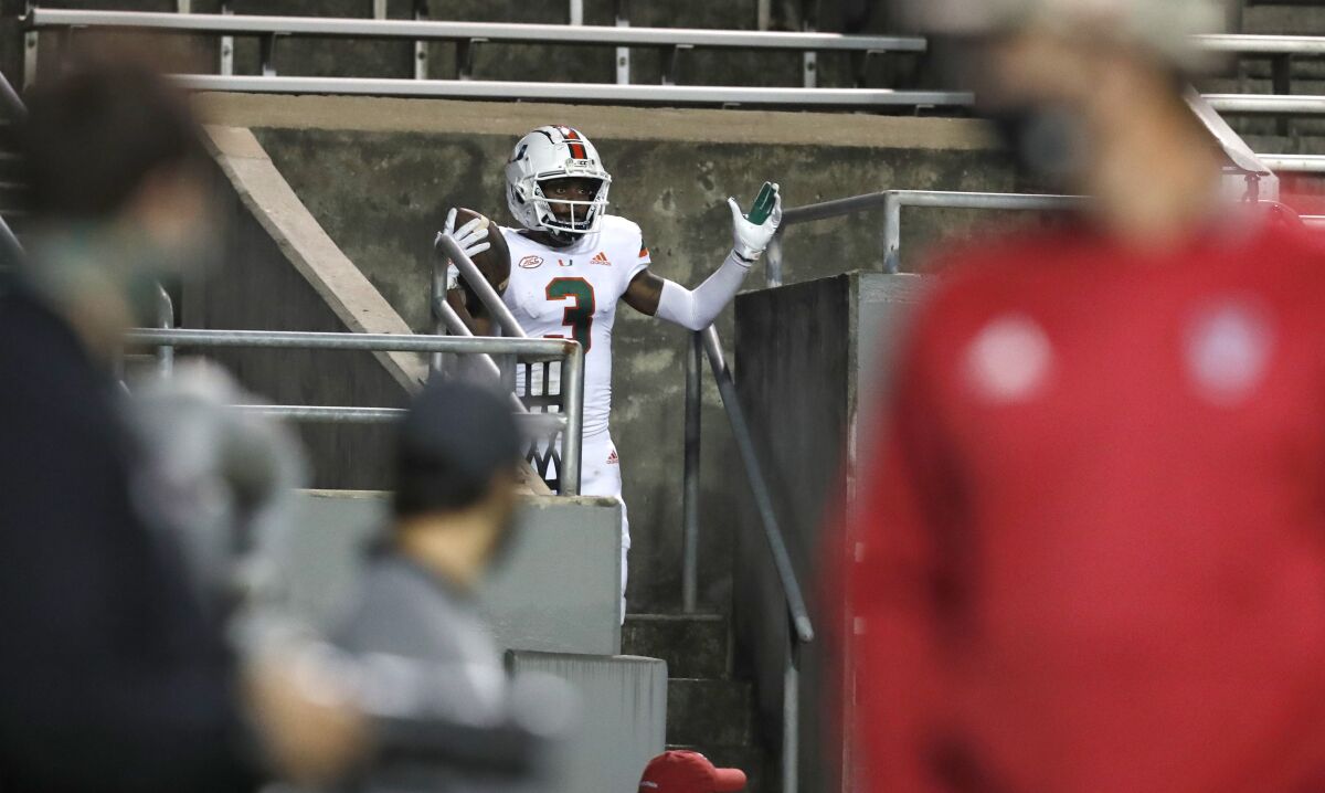 Miami wide receiver Michael Harley celebrates after running into the stands following a touchdown reception Nov. 6, 2020.