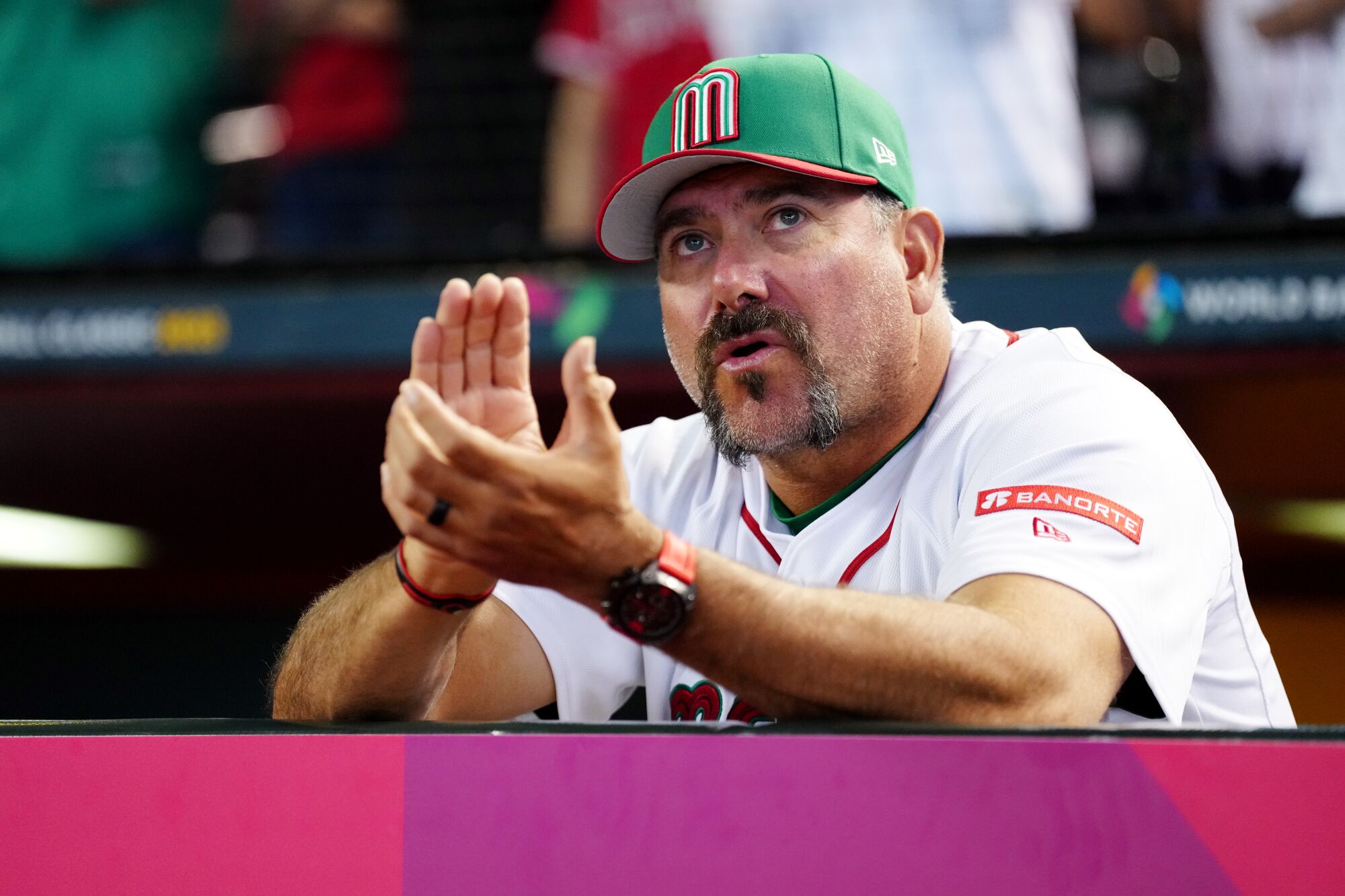 Mexico manager Benji Gil applauds during a World Baseball Classic match against Colombia on March 11.