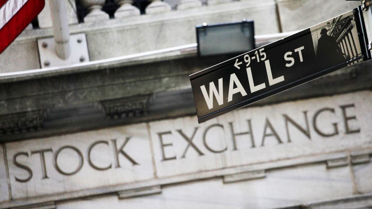 A Wall Street street sign outside the New York Stock Exchange.