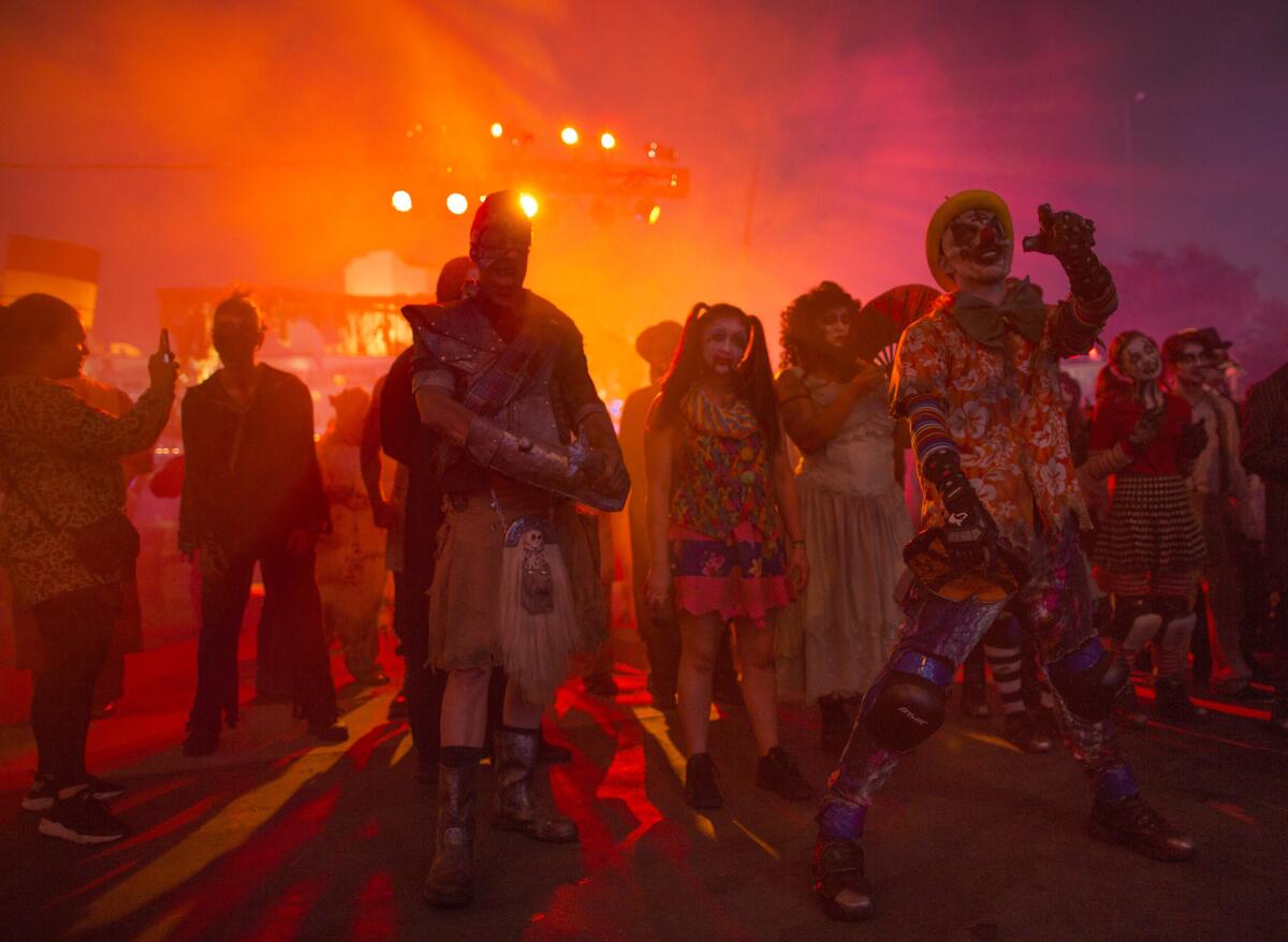 Monsters wait for the gates to open to greet guests at Queen Mary's Dark Harbor Halloween celebration.