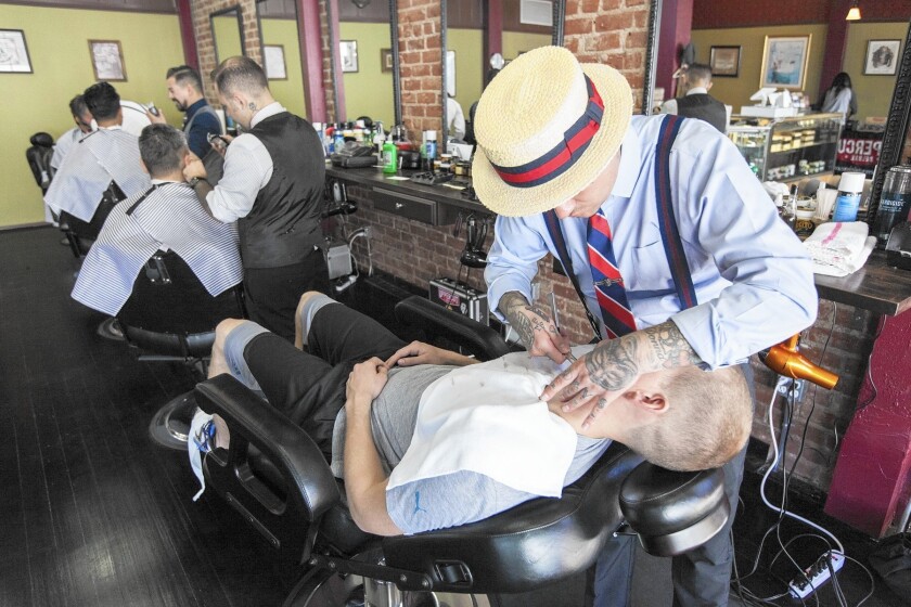 Manly & Sons Barber Co. in Echo Park features classic barber chairs, vintage furnishings, and barbers clad in retro-cool attire. In addition to barber services, it sells grooming products and fashion accessories.