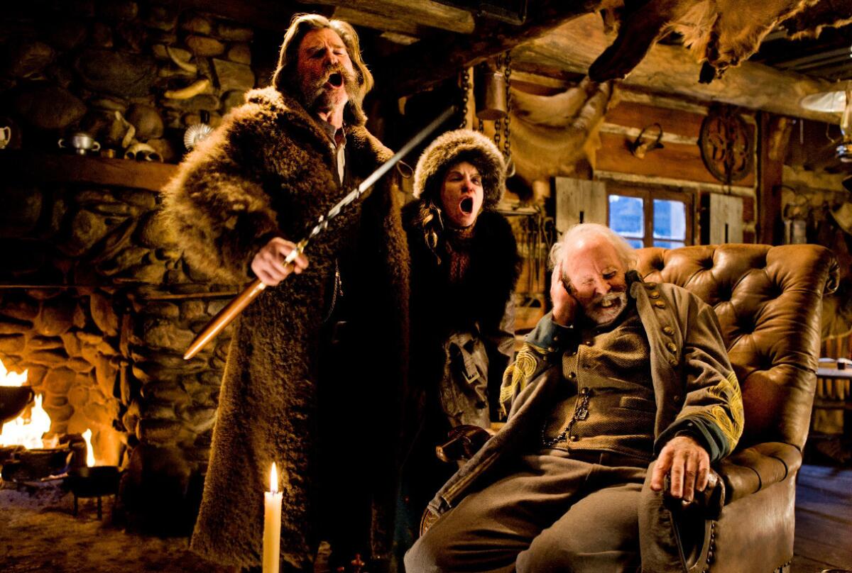 Kurt Russell, left, as John Ruthin in a scene from "The Hateful Eight."