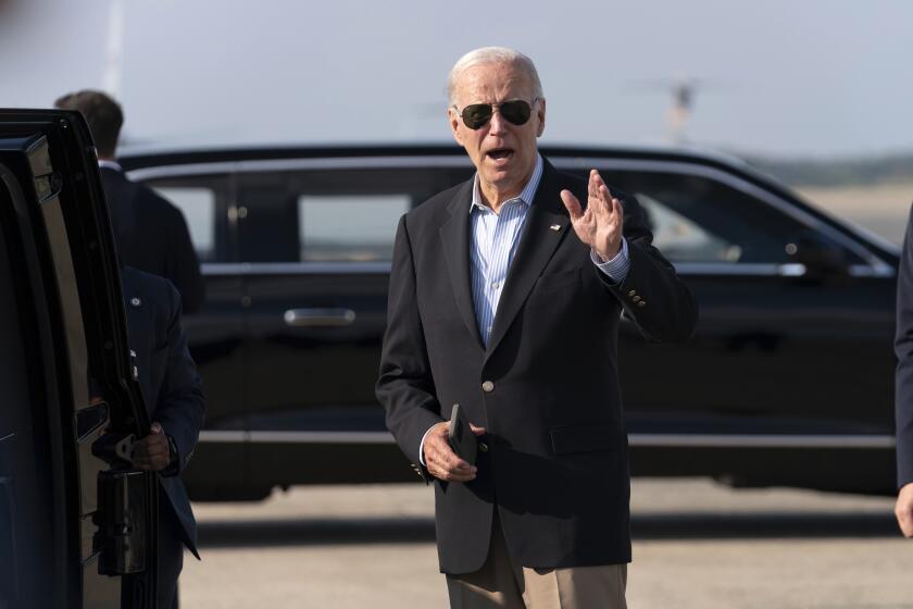 President Joe Biden talks to reporters upon his arrival to Joint Base Andrews, Md., en route to the White House, Sunday, Aug. 18, 2024. (AP Photo/Jose Luis Magana)