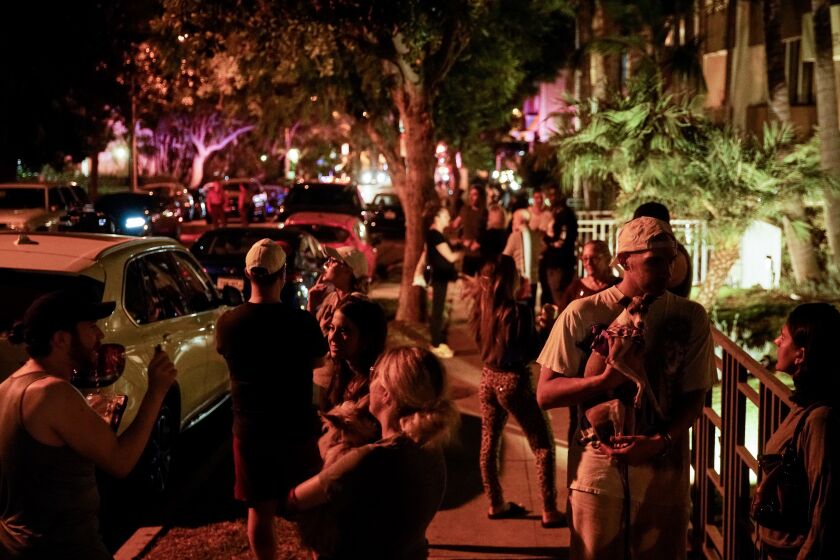WEST HOLLYWOOD, CALIF. - SEPTEMBER 17: People gather outside of Ed Buck’s apartment complex in West Hollywood on Tuesday, September 17, 2019 in West Hollywood, Calif. Buck was arrested by Sheriff’s deputies and charged with operating a drug house.(Kent Nishimura / Los Angeles Times)