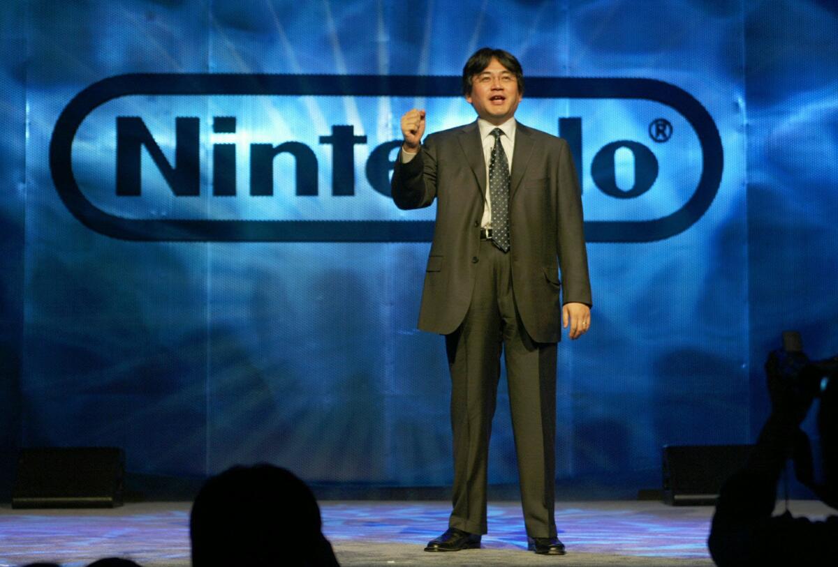 Satoru Iwata, director and general manager of Nintendo Co. Ltd., speaks during a news conference at the Electronic Entertainment Expo in Los Angeles on May 13, 2003.