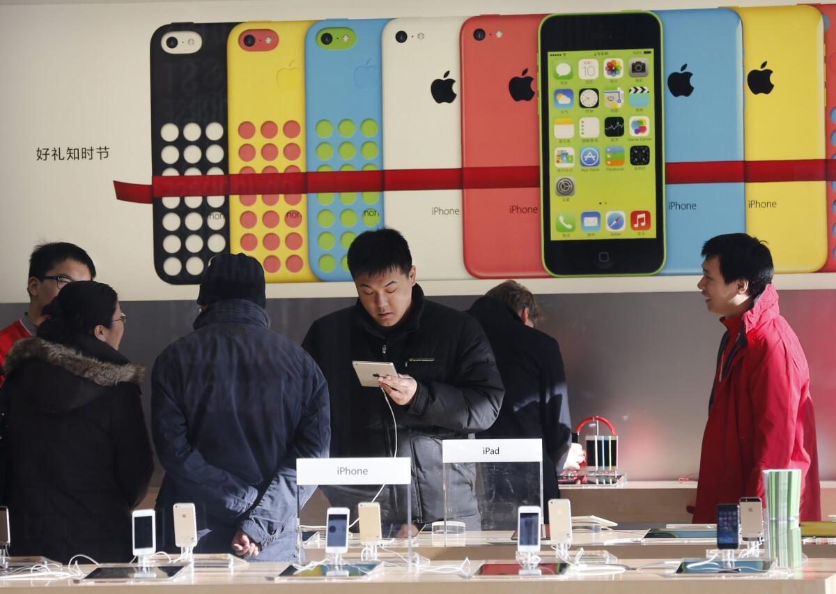A deal with China Mobile is expected to give Apple iPhone sales a big boost. Above, an Apple store in Beijing.